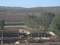 Inner Mongolia countryside - characters on hill.JPG