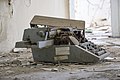 Rusty Optima typewriter side in an hungarian abandoned factory.jpg